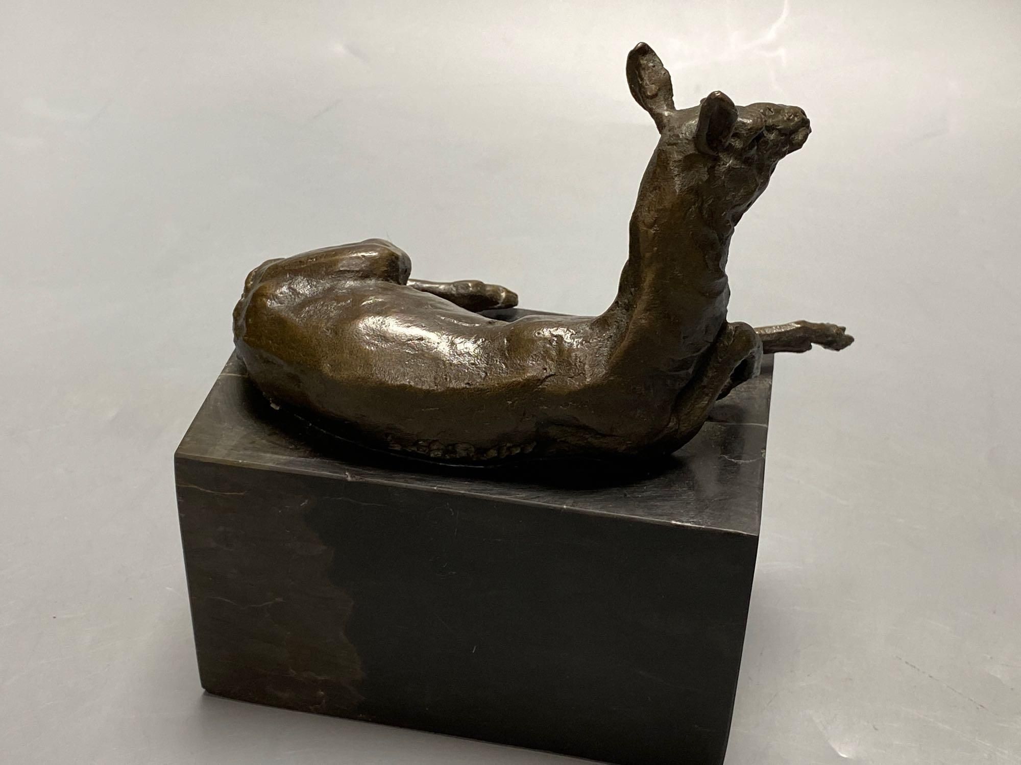 A bronze model of a recumbent mule, indistinctly signed, on marble plinth, width 12cm